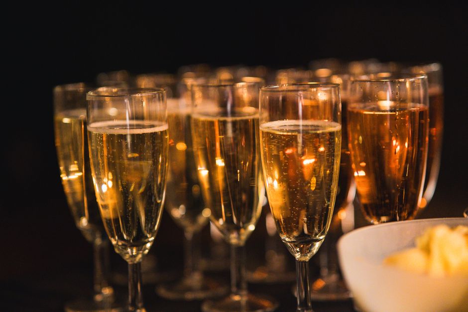Champagne glasses toast at an event